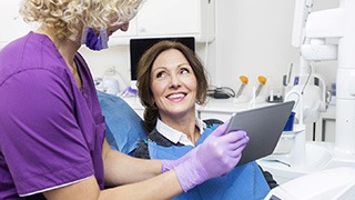 A middle-aged woman listening to her dentist 